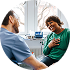 Woman in green shirt smiling at man in blue shirt